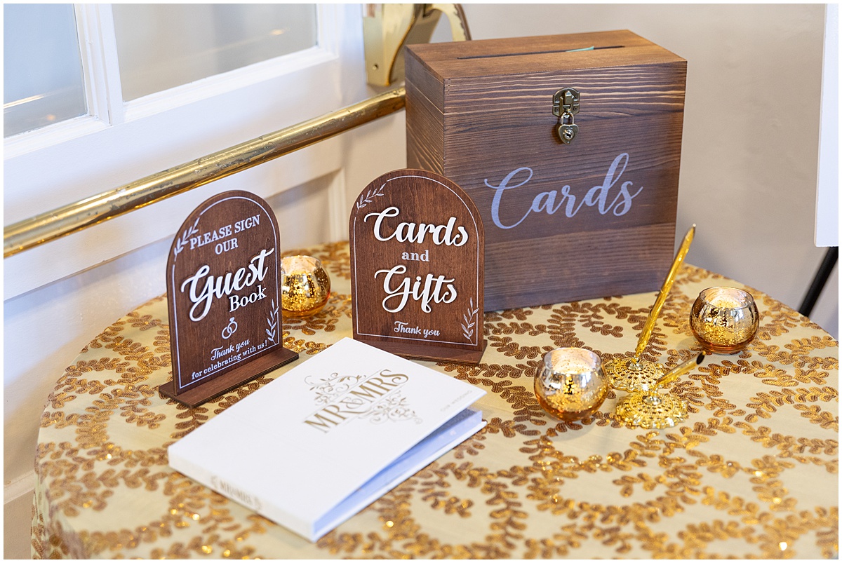 Wedding cards and gifts table with wooden card box and guest book