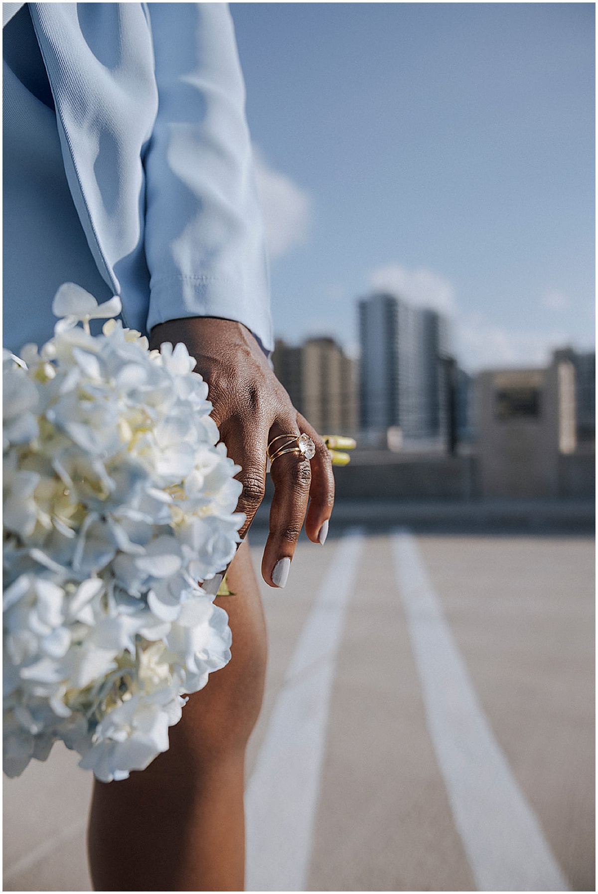 Bride showing her engagement ring and bouquet at a Palm Beach County courthouse wedding