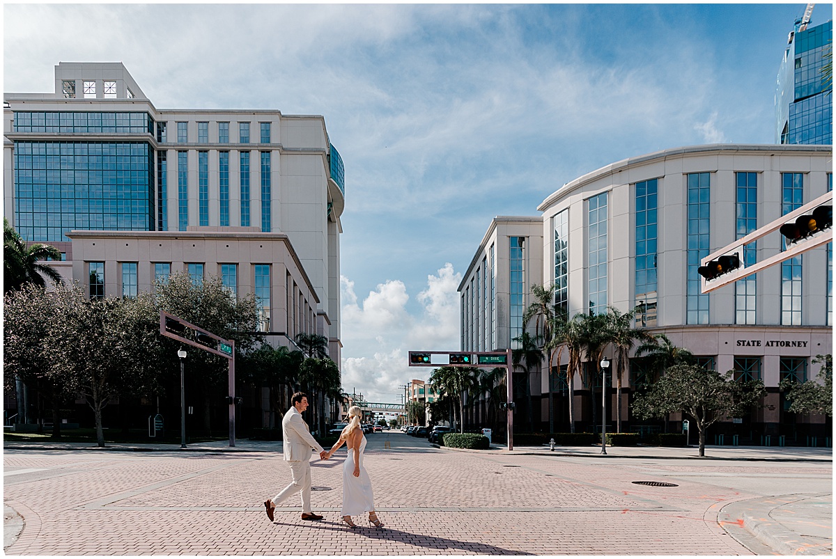 Couple walking near the Palm Beach County Courthouse in downtown West Palm Beach