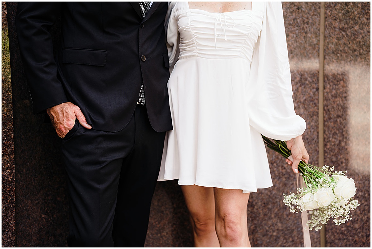 Married couple holding hands and showing their wedding rings in Palm Beach County