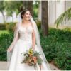 Bride at a Palm Beach wedding venue holding a colorful bouquet