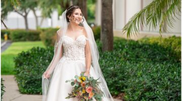Bride at a Palm Beach wedding venue holding a colorful bouquet
