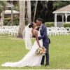 Bride and groom kissing after their outdoor Palm Beach wedding ceremony.