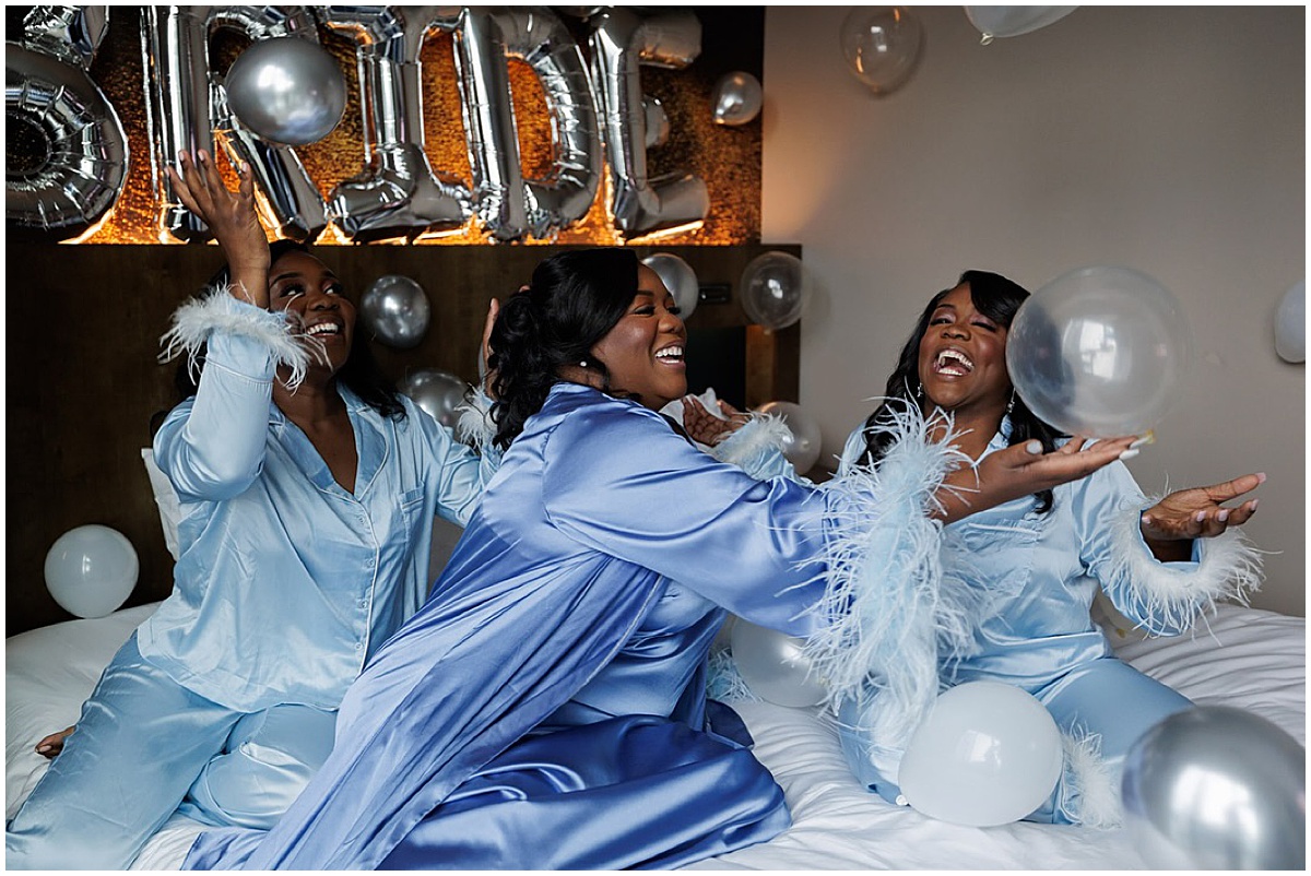 Bride and bridesmaids having fun while getting ready for a Palm Beach wedding.